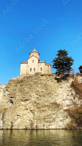 TBILISI, GEORGIA  DECEMBER 14, 2019:  Old Tbilisi architecture, Metekhi church in Tbilisi, Georgia
