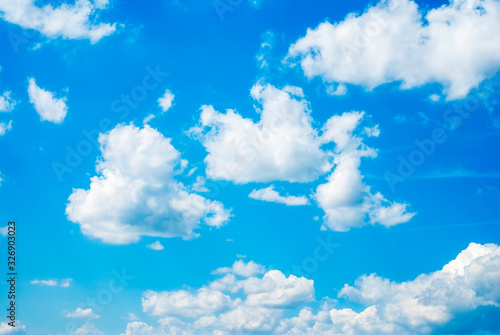 Fototapeta Naklejka Na Ścianę i Meble -  Blue sky background with white fluffy clouds
