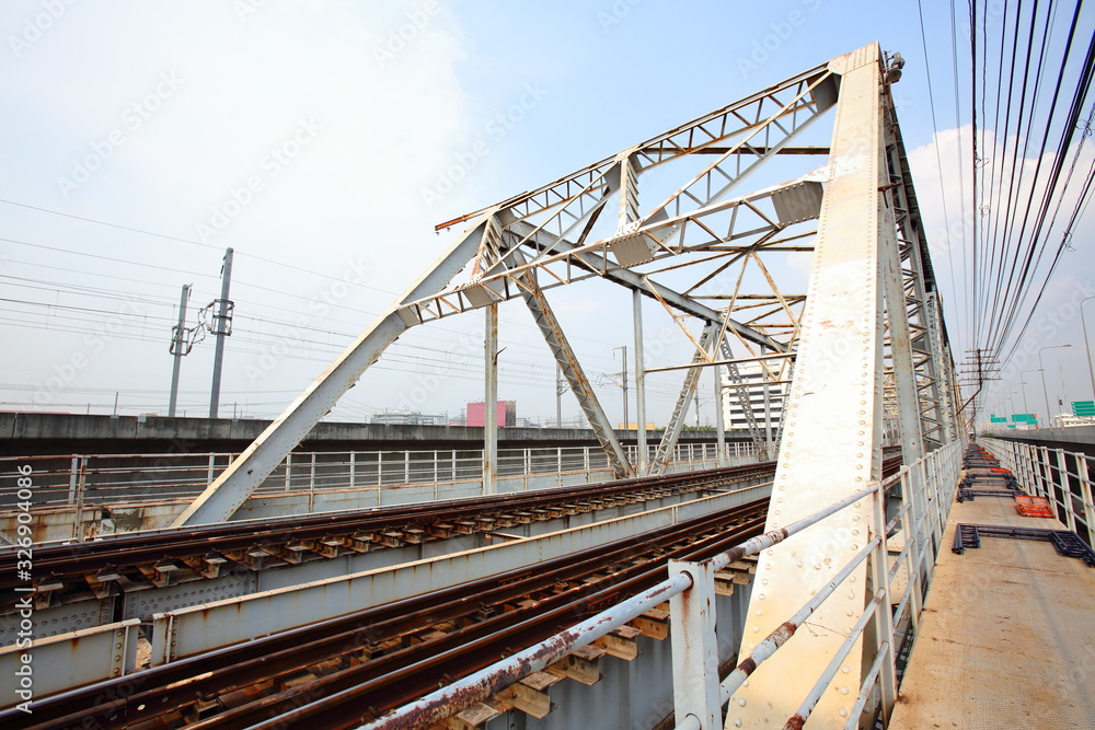 Structural steel bridge,Rama VI Bridge is a railway bridge over the Chao Phraya River in Bangkok,in Thailand,The form of a bridge in the olden days,often with steel structures.