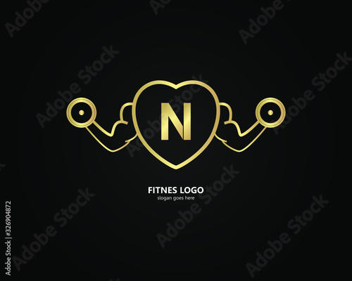 Fototapeta the letter N logo and the gym logo. the combination of the letter N and the hand holding barbell design. gold texture. Modern template. unique, simple and luxurious. for cards and graphic design.