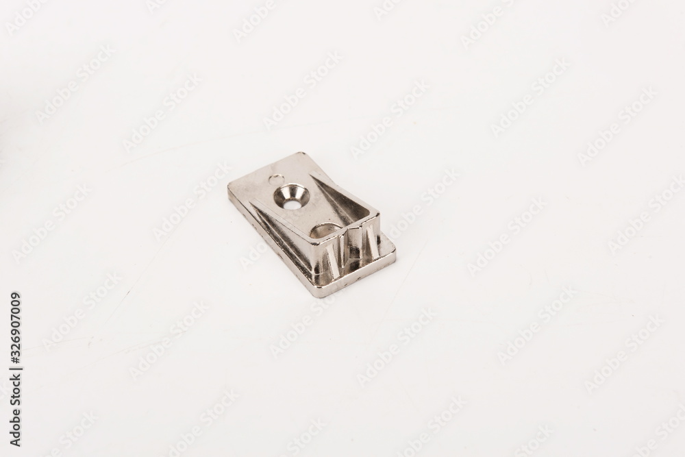 The simple silver metal deadbolt against a white background The simple silver metal deadbolt against a white background