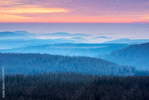 Aussicht über Hügellandschaft mit Talnebel bei Sonnenuntergang, Nationalpark Harz, Niedersachsen, Deutschland photo