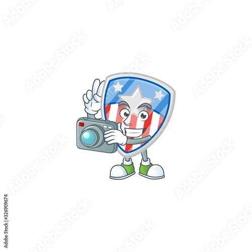A shield badges USA with star Photographer cartoon character in action with a camera © kongvector
