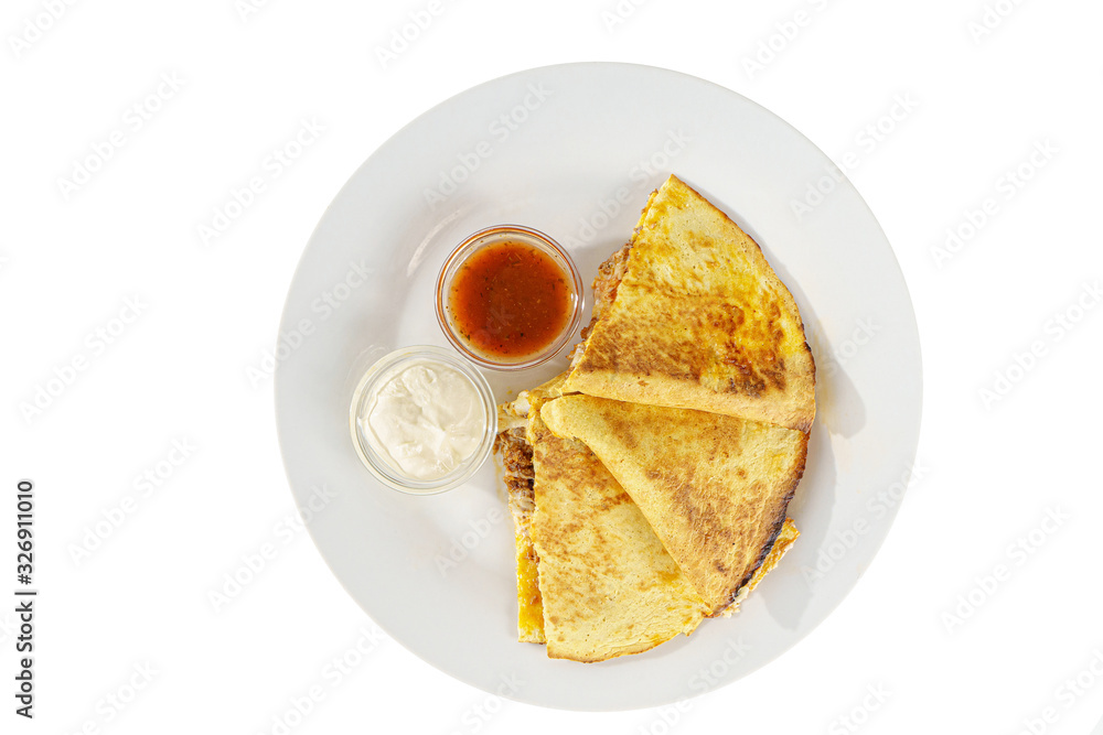 Quesadilla with minced meat and cheese, 3 slices, two sauces from tomatoes and sour cream, isolated white background, view from above Quesadilla with minced meat and cheese, 3 slices, two sauces from tomatoes and sour cream, isolated white background, view from above
