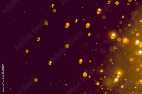 Abstract gold blur glitter bokeh on black