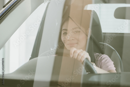 Asian girl smiling relaxing sitting and prepare drive safety