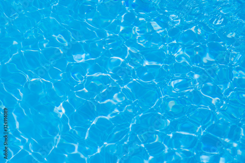 Blue water ripple reflection in the swimming pool