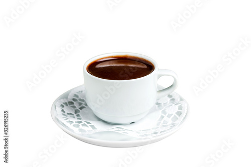 A small white cup of dark hot chocolate on a white saucer and a napkin