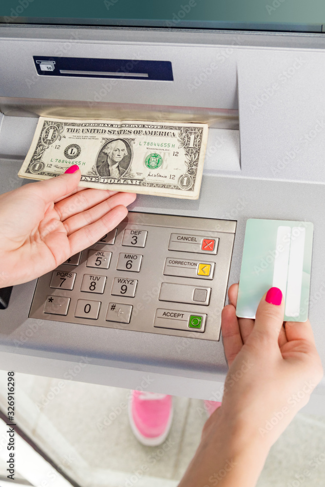 Woman using modern ATM nashine - cash withdrawal. Woman using modern ATM nashine - cash withdrawal.