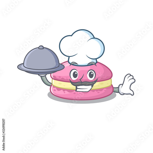 A picture of strawberry macarons as a Chef serving food on tray