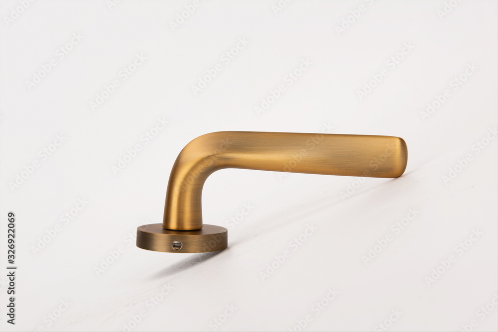 Gold metal handle on white background