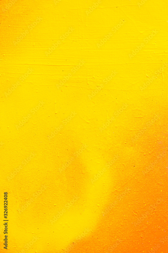 Abstract metal texture by spray can of paint. Gradient in orange, yellow. Vertical.