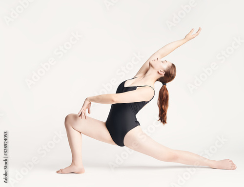 brunette girl shows different elements of ballet on a white background