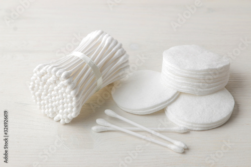 Various personal care products. Cotton pads and sticks on a white background close-up