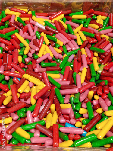 Colorful candy on store shelves closeup. Colorful chewable candies.