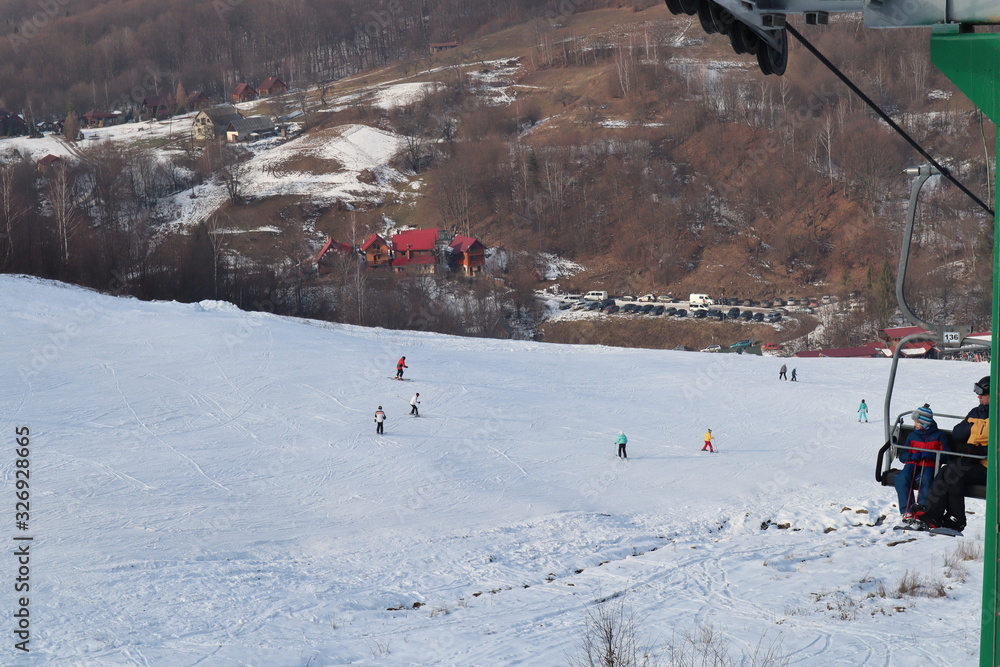 people enjoy outdoor activities in the mountains, skiing and snowboarding people enjoy outdoor activities in the mountains, skiing and snowboarding