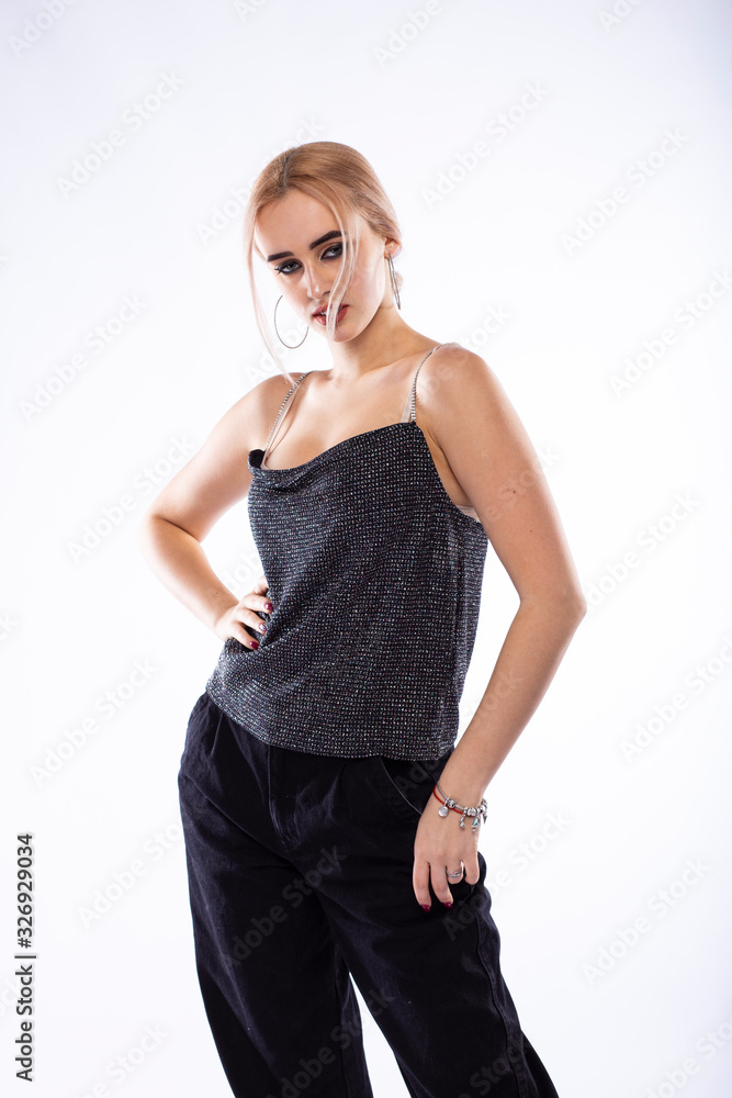 The portrait of young blonde woman on white background The portrait of young blonde woman on white background
