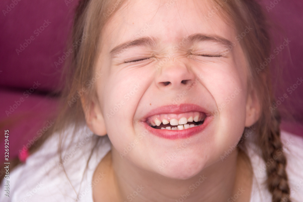 Little girl shows her teeth. Baby teeth concept. Little girl shows her teeth. Baby teeth concept.
