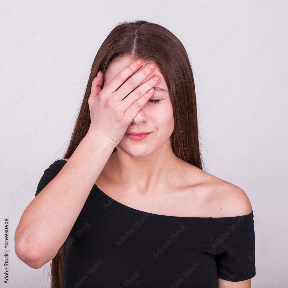 Close up portrait of a young beautiful girl isolated on gray background Close up portrait of a young beautiful girl isolated on gray background