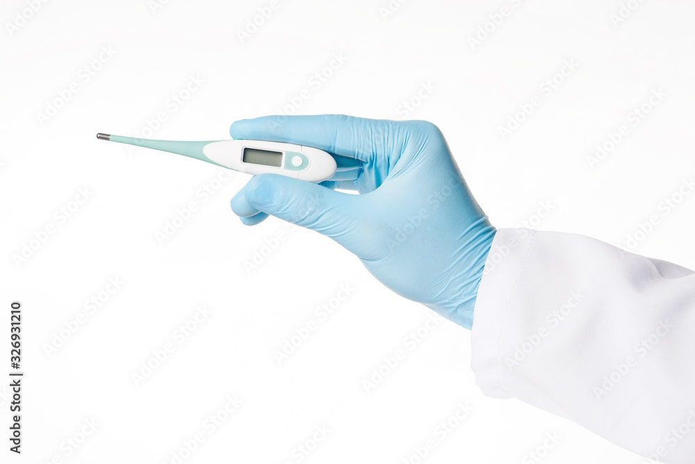 Human hand in a blue latex medical glove hold a thermometer Human hand in a blue latex medical glove hold a thermometer
