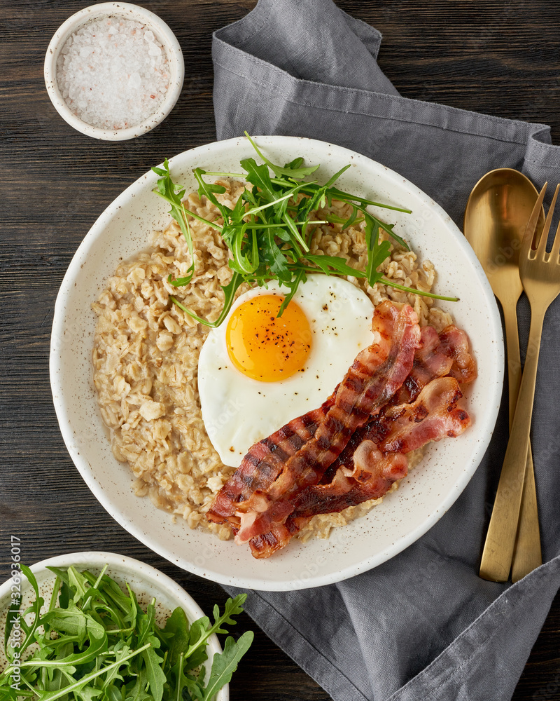 Oatmeal, fried egg, fried bacon. Balance of proteins, fats, carbohydrates. Balanced food