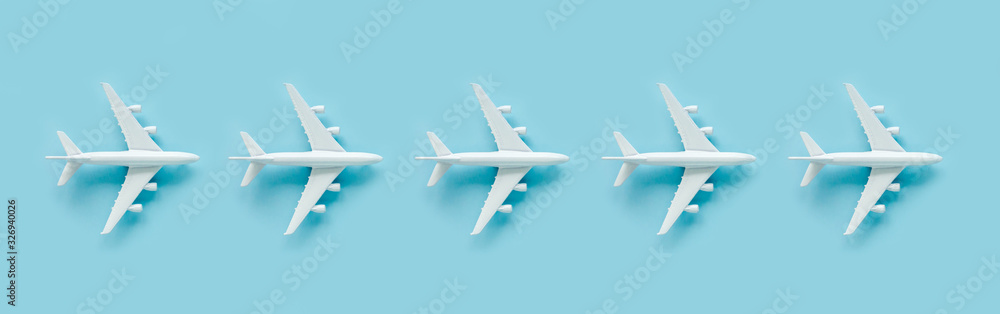 Pattern, seamless white model airplane texture, plane on blue background. Top view, flat lay. Travel, vacation concept. Banner. Pattern, seamless white model airplane texture, plane on blue background. Top view, flat lay. Travel, vacation concept. Banner.