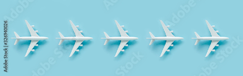 Pattern, seamless white model airplane texture, plane on blue background. Top view, flat lay. Travel, vacation concept. Banner.