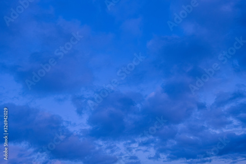 abstract background of dramatic cloudy sunset sky blue hour