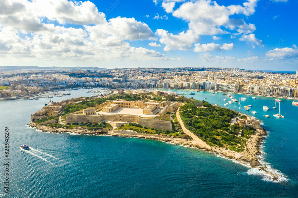 Aerial panorama view of Fort Manoel on Manoel island, Gzira city. Blue sky and clouds. Malta country