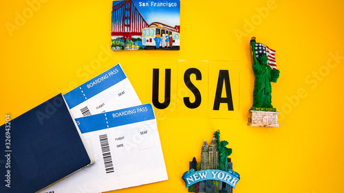 Passport with boarding pass, USA flag, magnets from new york and san francisco, statue of liberty, Travel concept