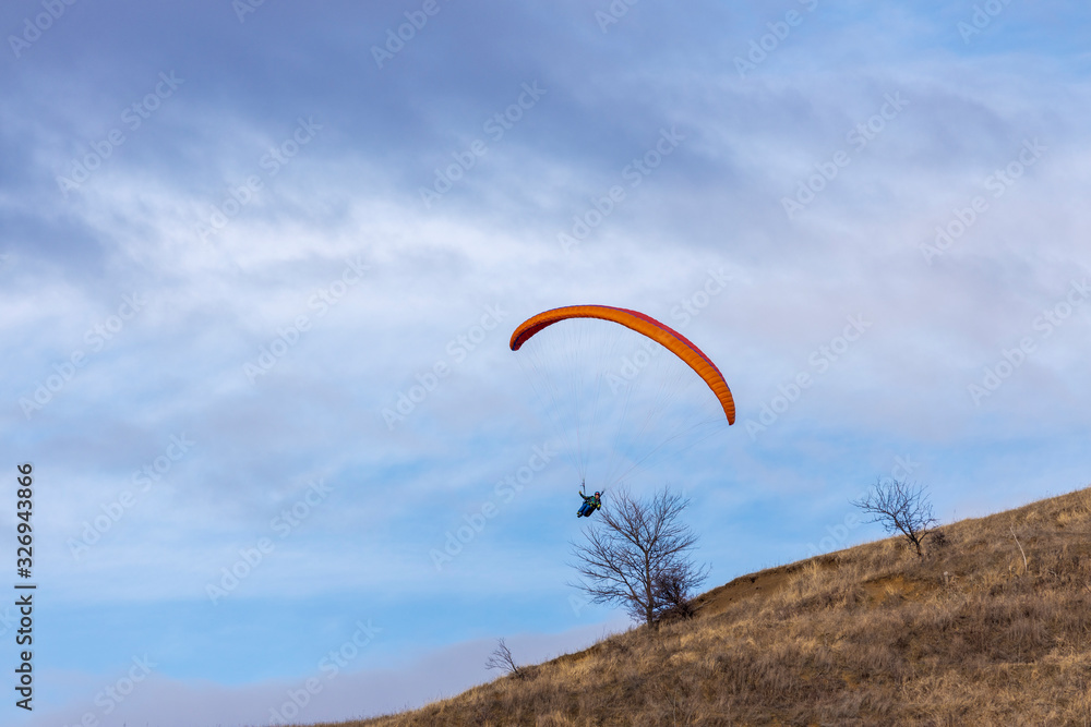 Skydiver On Colorful Parachute In Sky. Active Hobbies Skydiver On Colorful Parachute In Sky. Active Hobbies