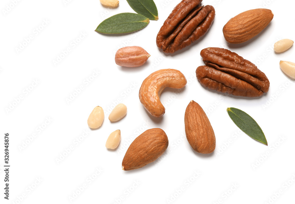Different delicious nuts on white background, flat lay. Space for text Different delicious nuts on white background, flat lay. Space for text