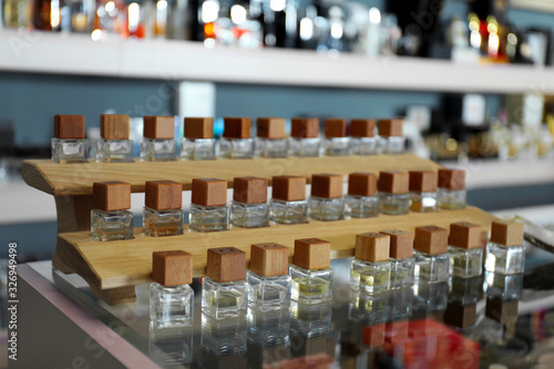 Perfume bottles on glass counter in shop