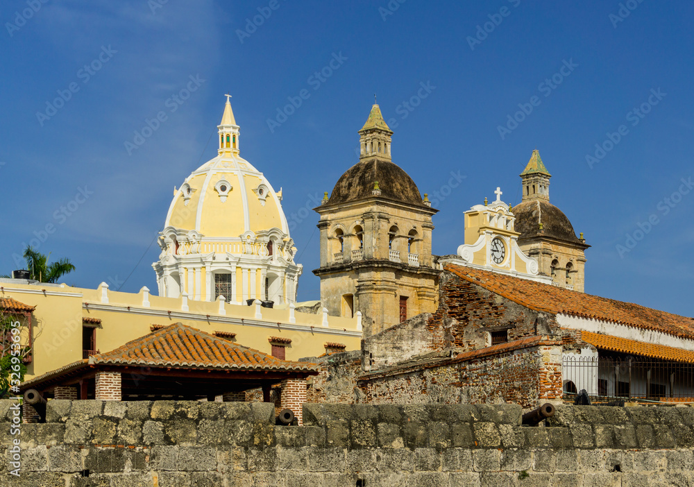 Detail of Cartagena city wall with canon and Sanctuary of Saint Peter Claver in the background.