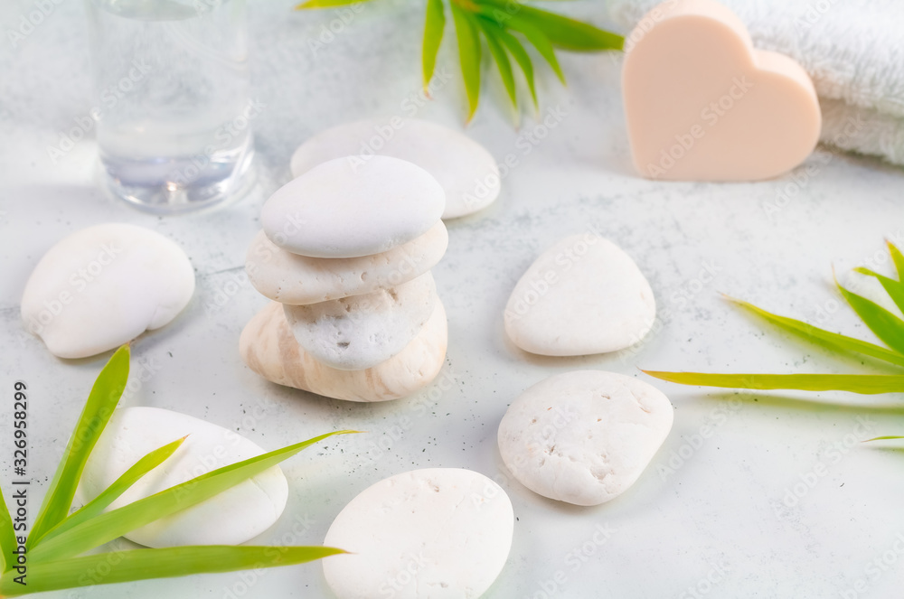 Cosmetic and Beauty spa relaxing concept. White natural zen stones scene on white marble. wellness natural therapy. Cosmetic and Beauty spa relaxing concept. White natural zen stones scene on white marble. wellness natural therapy.