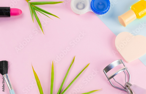 Top view beauty cosmetics frame and pastel background. Copy space add product.