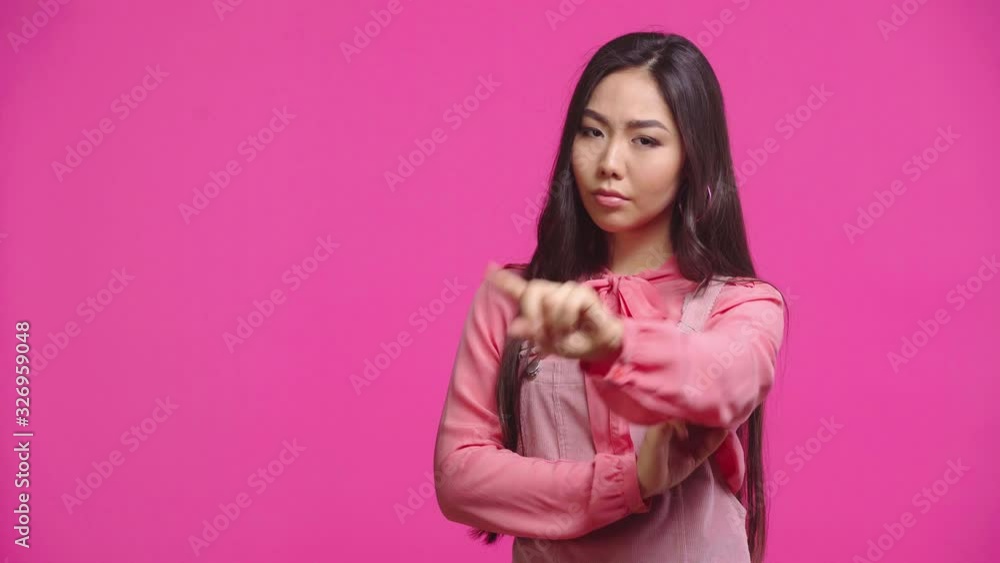 displeased kazakh girl showing no gesture isolated on pink displeased kazakh girl showing no gesture isolated on pink