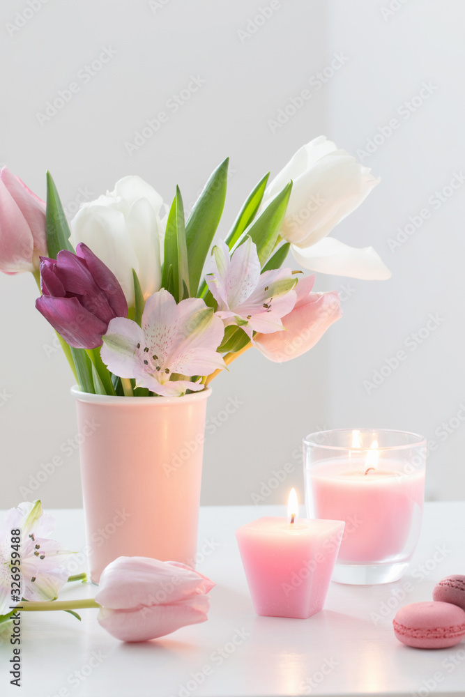 Tulips in vase and macaroons on white background. Concept woman's or mother's day Tulips in vase and macaroons on white background. Concept woman's or mother's day