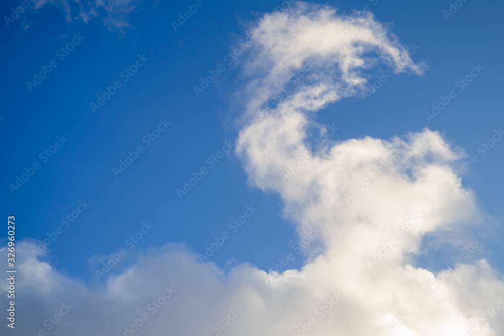 Bright white with grey clouds on blue sky. Bright white with grey clouds on blue sky.