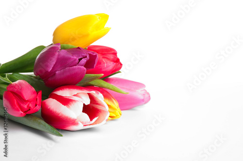 Fototapeta Naklejka Na Ścianę i Meble -  Beautiful bright spring tulips on white background, closeup