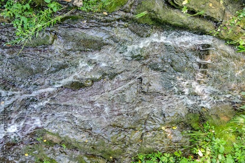 stream in forest, digital photo picture as a background , taken in bled lake area, slovenia, europe photo