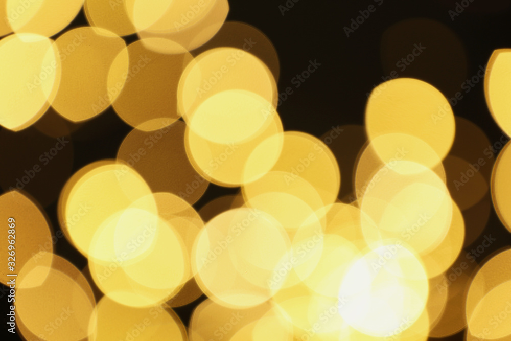 Blurred view of beautiful lights on black background. Bokeh effect Blurred view of beautiful lights on black background. Bokeh effect