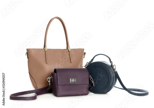 Different stylish woman's bags isolated on white photo