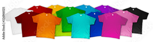 wide panorama banner row of many fresh new fabric cotton t-shirts in colorful rainbow colors isolated. Pile of various colored shirts white background. diy printing fashion concept.