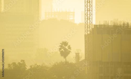 Smog and haze envelop buildings under construction in a residential district in Kandivali East in suburban Mumbai. photo