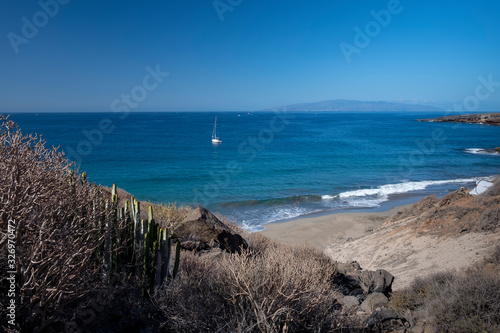 Yacht on the ocean by coastline near Adeje  Ternerife  Spain