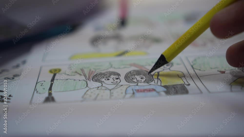 Designer or creative discussion in drawing storyboard for film movie,Video Pre-production process media films in form display script production. Business of media clip, design shot layout in studio,4K