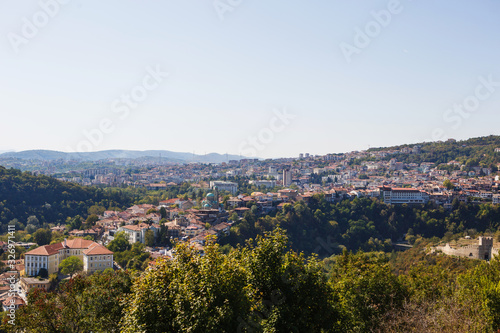 View from the Tsarevets fortress to the city of Veliko Tarnovo. Brown tiled roofs of Bulgarian houses-typical Balkan settlement