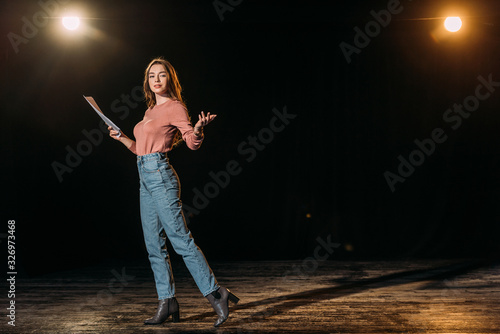 Fototapeta attractive young actress performing role on stage in theatre