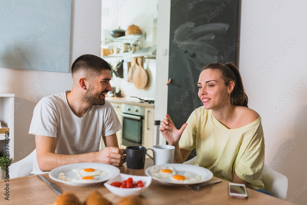 romantic couple having breakfast at home romantic couple having breakfast at home